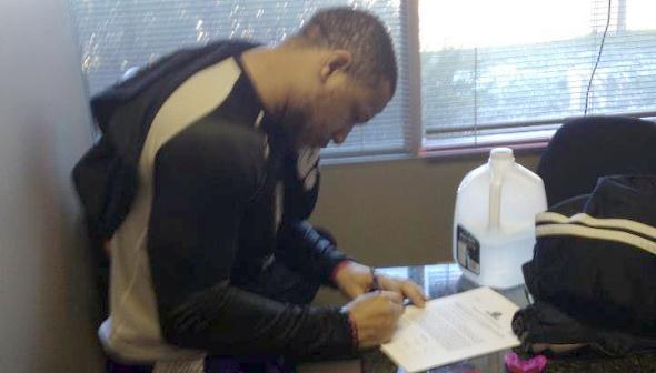 booker contract_590 Kenny Booker signing Bellator contract, courtesy Suckerpunch Ent.
