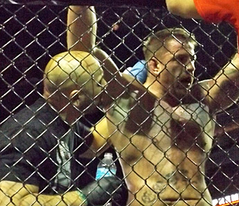 Alex Trujillo gives instructions to Adam Maciejewski at XFO 49